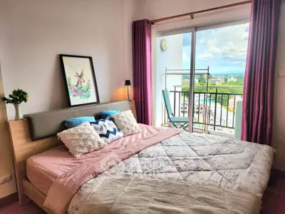 Cozy bedroom with balcony view in modern apartment