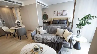 Luxurious modern studio apartment with elegant decor and cozy living area.