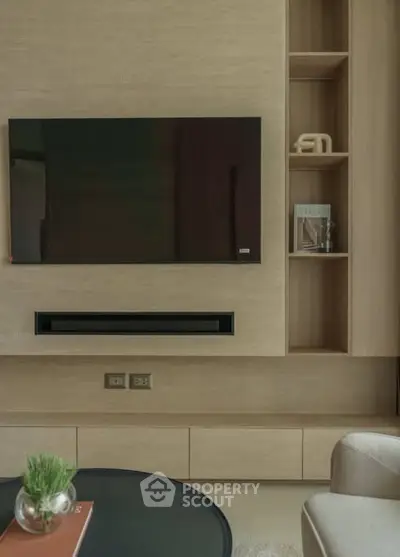 Modern living room with sleek TV setup and stylish shelving
