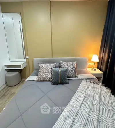 Modern bedroom with stylish decor and cozy lighting