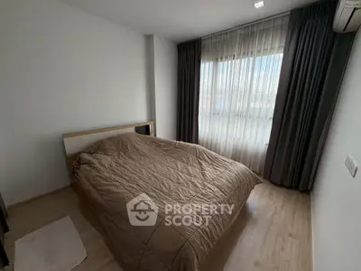 Cozy bedroom with natural light and modern decor