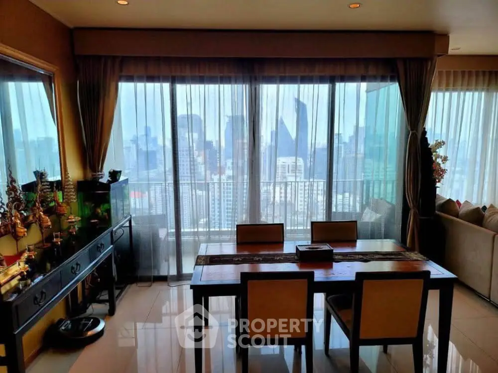 Stunning city view from elegant dining room with floor-to-ceiling windows and stylish decor.