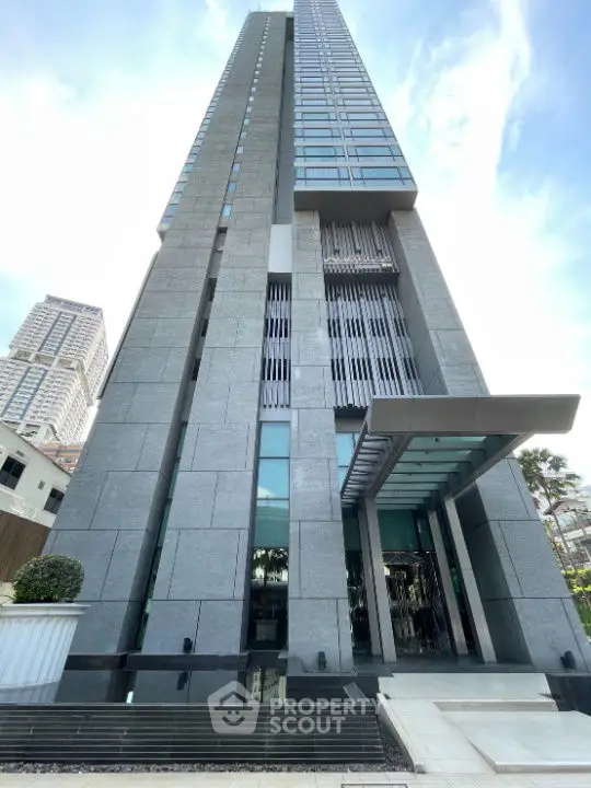 Stunning modern high-rise building with sleek architectural design and glass facade.