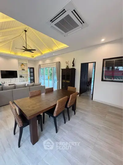 Spacious living room with elegant dining area and modern decor