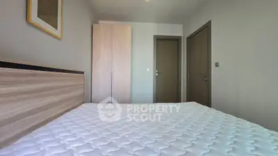 Modern minimalist bedroom with wooden accents and cozy ambiance