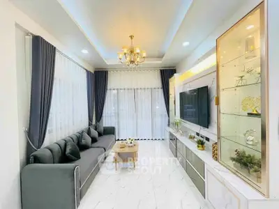 Luxurious modern living room with elegant chandelier and sleek furniture