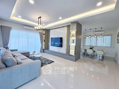 Spacious modern living room with elegant decor and open dining area