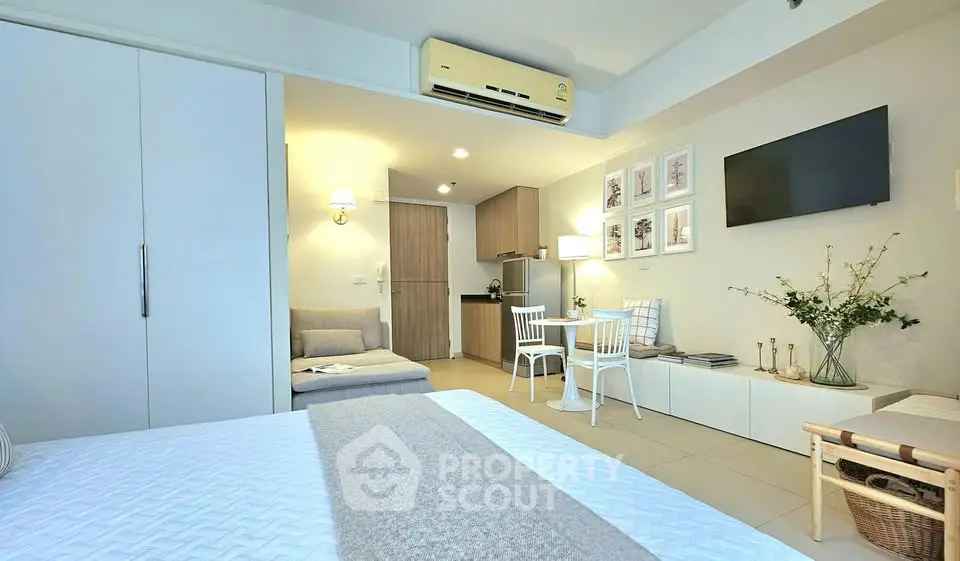 Modern studio apartment with cozy living area and stylish decor
