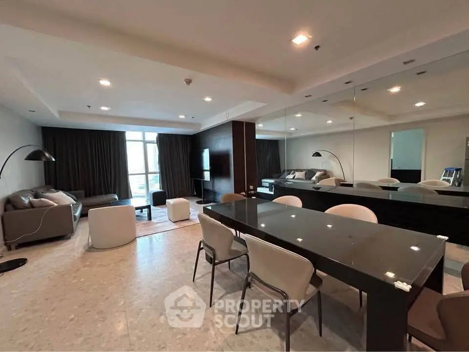Spacious modern living room with elegant dining area and large windows
