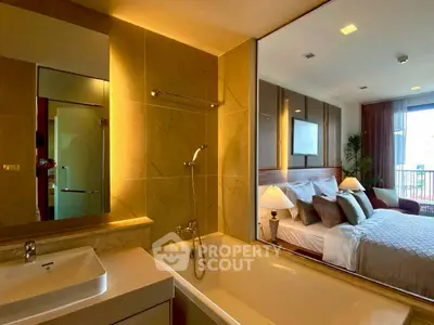 Luxurious bedroom with ensuite bathroom featuring a modern bathtub and elegant decor.