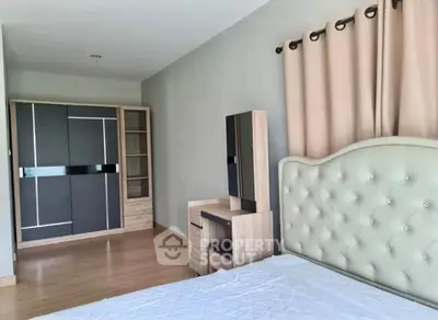 Spacious bedroom with modern furniture and elegant decor