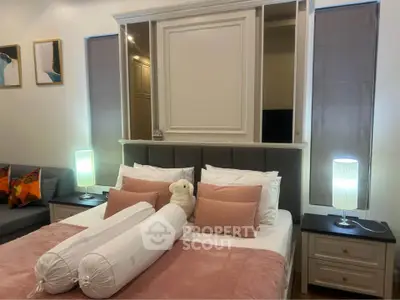 Cozy bedroom with elegant decor and soft lighting, featuring plush pillows and stylish bedside lamps.
