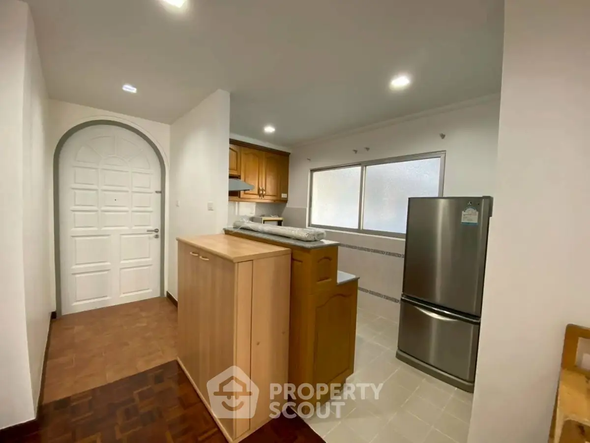 Spacious kitchen with modern appliances and closed layout