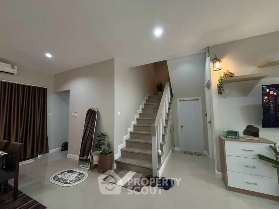 Modern interior with staircase and cozy decor in a stylish home
