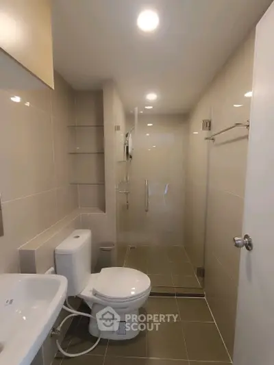 Modern bathroom with sleek design and glass shower enclosure