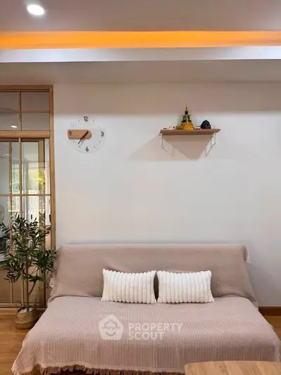 Cozy living room with modern decor and comfortable seating, perfect for relaxation.