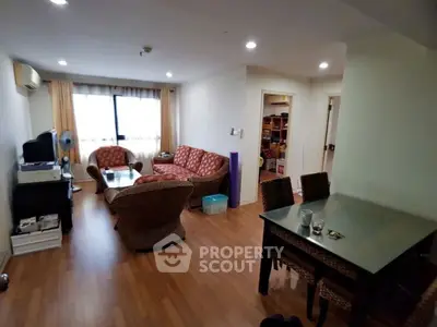 Spacious living room with cozy seating and dining area, perfect for family gatherings.