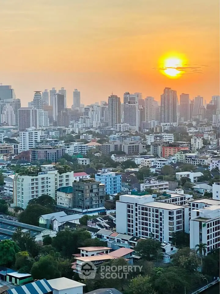 Stunning cityscape view at sunset showcasing urban skyline and residential buildings.