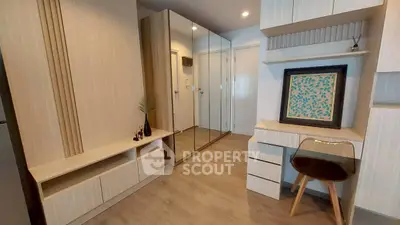 Modern study area with sleek desk and mirrored closet doors