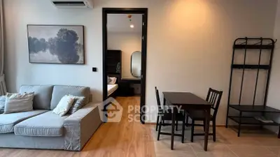 Modern living room with cozy sofa and dining area in stylish apartment