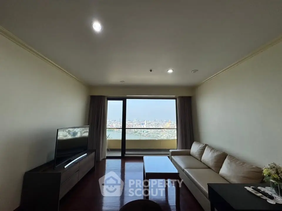 Spacious living room with stunning city view and modern furnishings