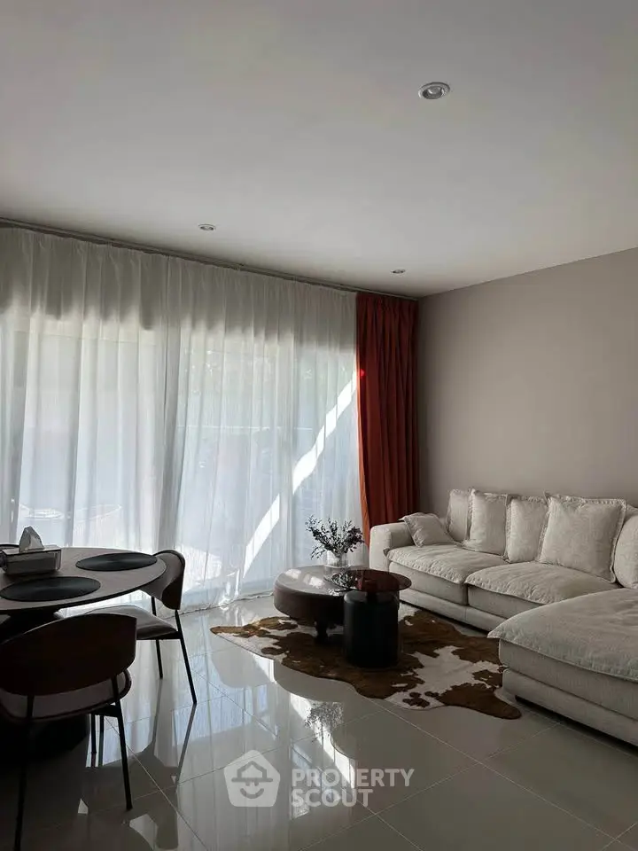 Elegant living room with modern furniture and natural light