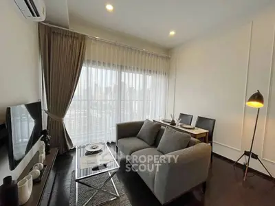 Modern living room with city view, featuring cozy sofa and dining area, perfect for urban living.