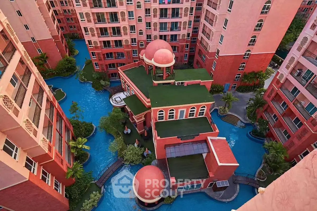Stunning aerial view of a vibrant residential complex with unique architecture and lush landscaping.