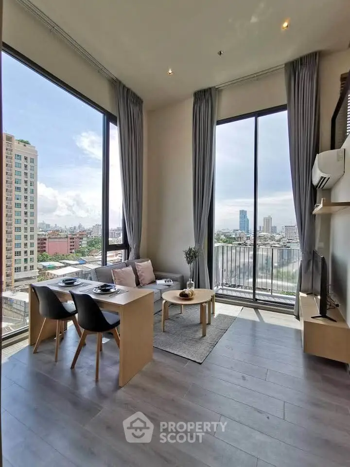 Modern living room with floor-to-ceiling windows and city view