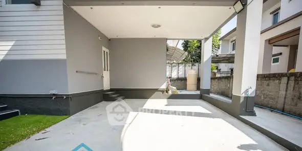 Spacious modern outdoor area with covered patio and sleek design