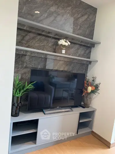 Modern living room with sleek TV stand and decorative shelving