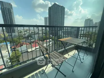 Spacious balcony with city view, perfect for relaxation and enjoying the skyline.