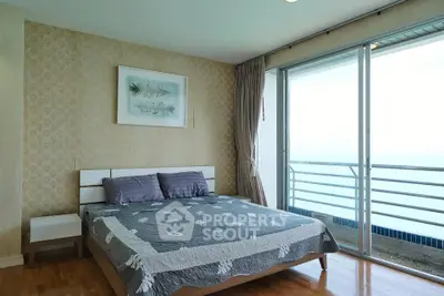 Spacious bedroom with ocean view and modern decor