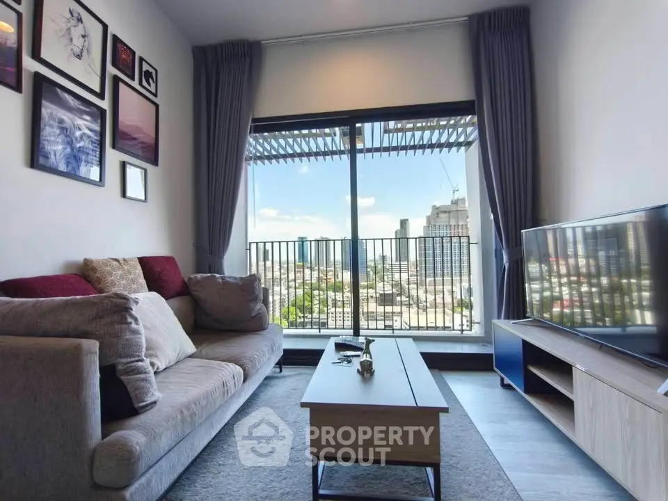 Modern living room with city view, stylish decor, and cozy seating area.
