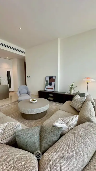 Luxurious living room with modern decor and cozy seating arrangement.
