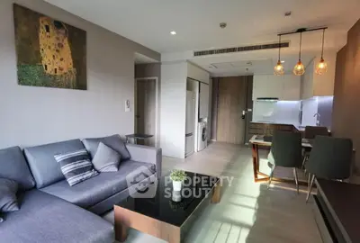 Modern living room with stylish decor and open kitchen layout