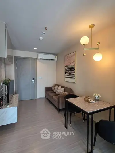 Modern living room with stylish decor and cozy seating area in a contemporary apartment.