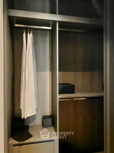 Spacious walk-in closet with modern design and ample storage space.