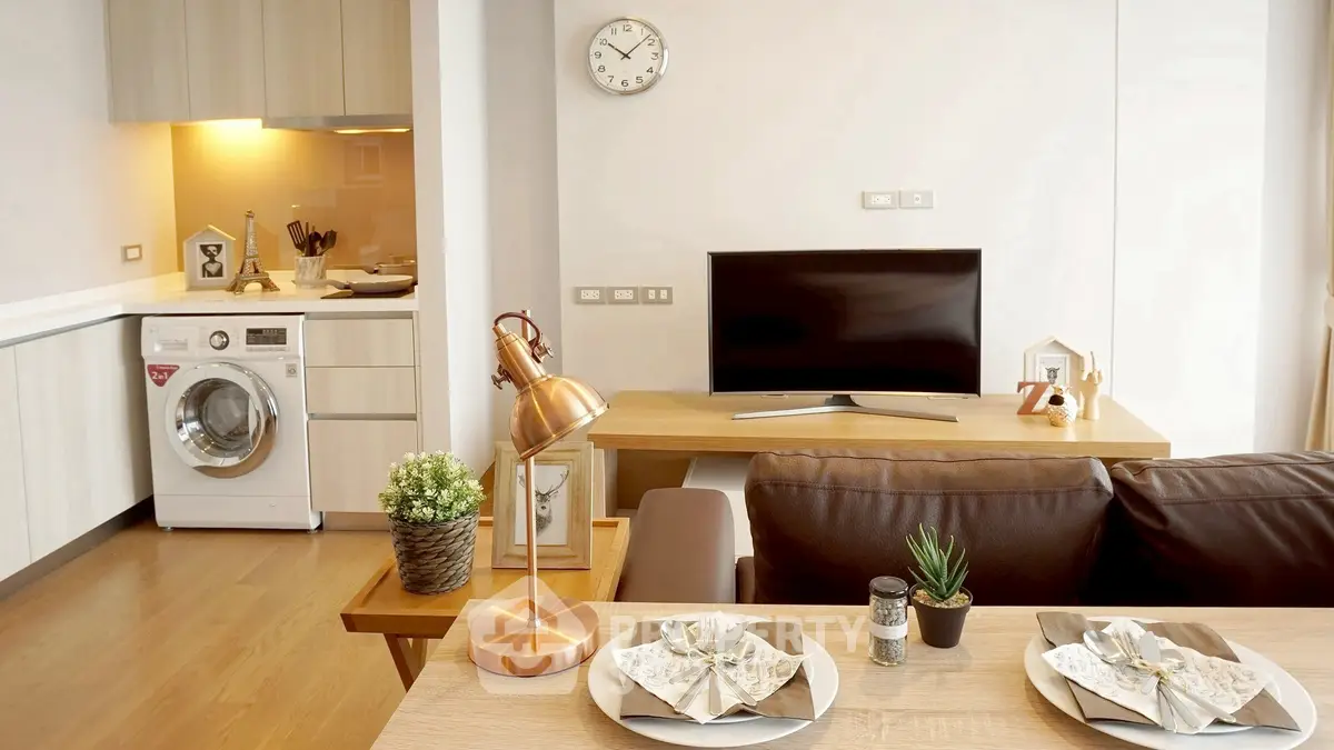 Modern living room with stylish decor and open kitchen layout