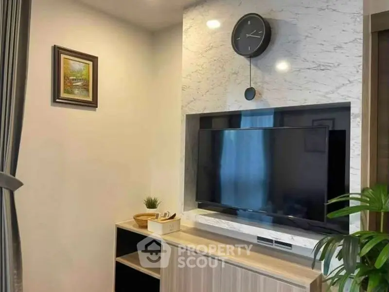 Modern living room with stylish TV setup and elegant decor