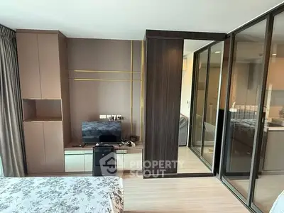 Modern bedroom with sleek design and ample storage space