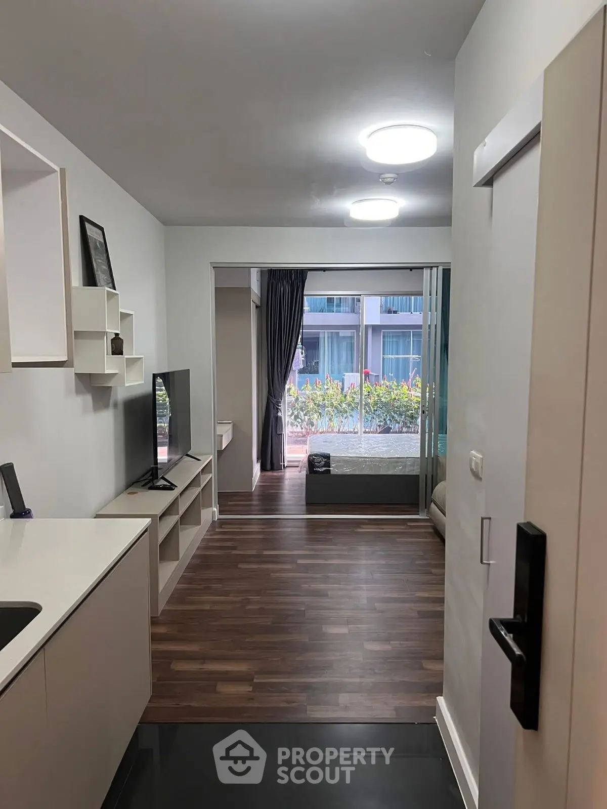 Modern apartment with open living area and balcony view
