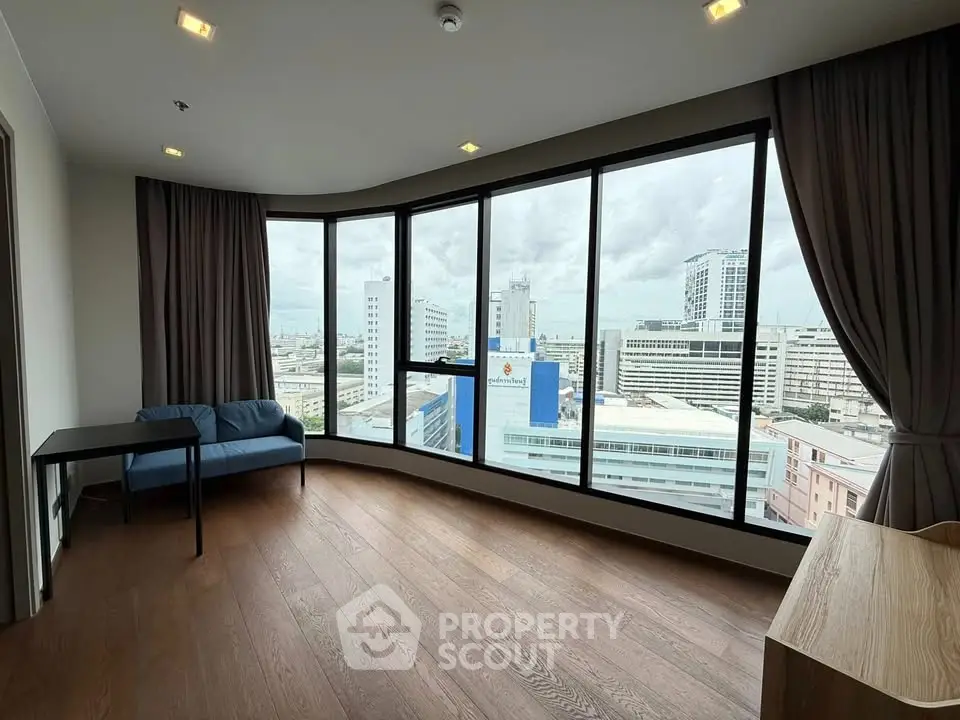Spacious corner unit with panoramic city views and modern furnishings.