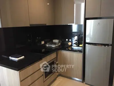 Modern kitchen with sleek cabinets and stainless steel appliances