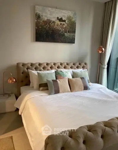 Luxurious bedroom with plush tufted bed and elegant decor, perfect for relaxation and comfort.