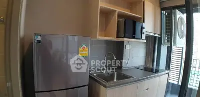 Modern kitchen with sleek appliances and open shelving in a compact layout.