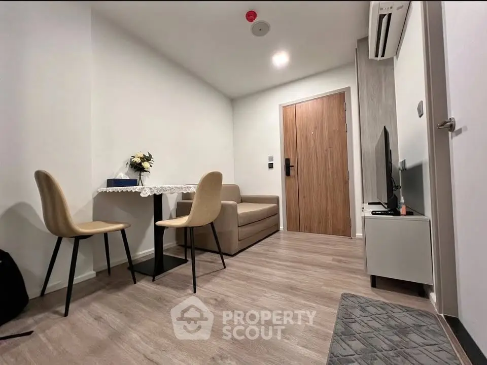 Modern living room with minimalist decor and cozy seating area