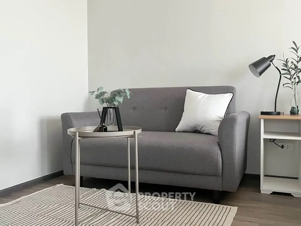 Modern living room with stylish gray sofa and elegant decor