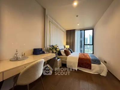 Luxurious bedroom with elegant decor and city view, featuring a cozy bed and stylish workspace.