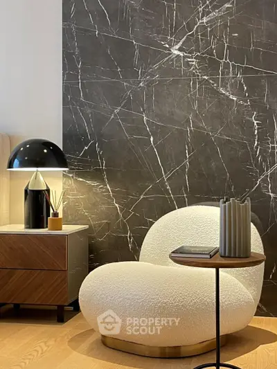 Stylish modern living room with unique chair and elegant decor